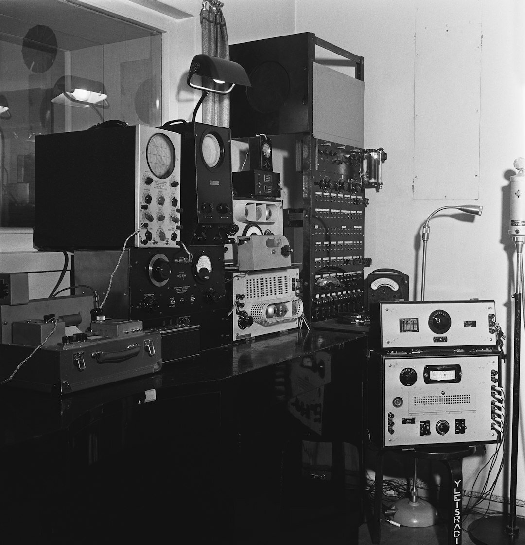 Team coordinating a live video broadcast in a control room