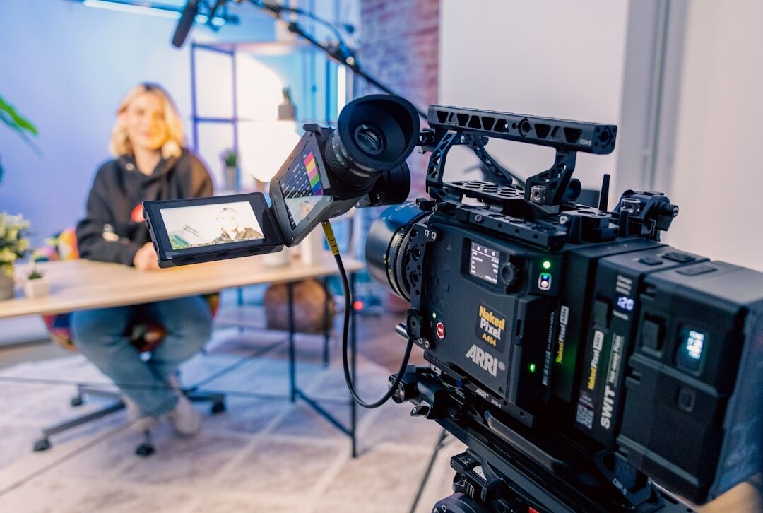 Professional video camera and microphone equipment on a table